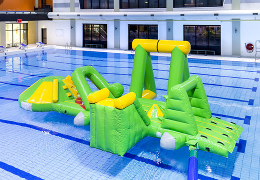 Airtight inflatable crocodile play island with a vine, climbing tower, round slide and obstacles for both young and old. Order inflatable water attractions now online at JB Inflatables America