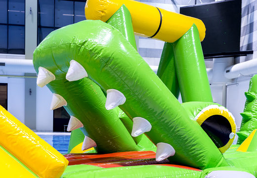 Cool crocodile themed play island with a vine, climbing tower, round slide and obstacles for both young and old. Order inflatable pool games now online at JB Inflatables America