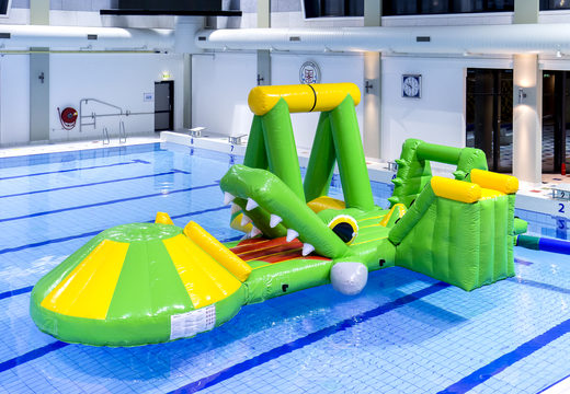 Order an inflatable airtight crocodile play island with a vine, climbing tower, round slide and obstacles for both young and old. Buy inflatable water attractions online now at JB Inflatables America
