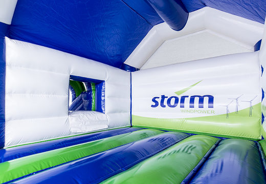 Order promotional inflatable Storm - Multifun Windmill inflatable bouncer with slide custom-made at JB Promotions America; specialist in inflatable advertising items such as custom bouncers