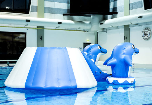 Buy a unique airtight island slide in a dolphin theme with the cheerful 3D dolphins and the cool design for both young and old. Order inflatable water attractions now online at JB Inflatables America