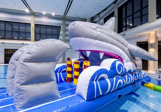 Buy an airtight shark-themed slide for both young and old. Order inflatable water attractions now online at JB Inflatables America