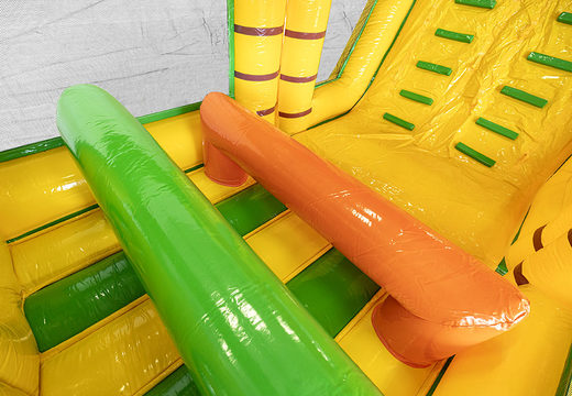 Obstacle course 13.5 meters long in a jungle theme with appropriate 3D objects for children. Order inflatable obstacle courses now online at JB Inflatables America