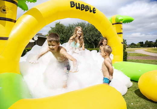 Bubble park bouncy castle with a foam crane in the Jungle theme for children. Buy inflatable bounce houses online at JB Inflatables America