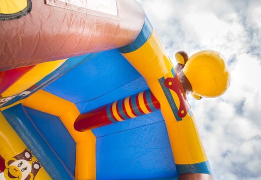 Order a standard bounce house for children in striking colors with a large 3D object in the shape of a monkey on top. Bounce house online for sale at JB Inflatables America