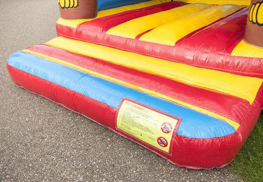Standard bounce houses in striking colors with a large 3D object of a monkey on top for sale for children. Buy bounce houses online at JB Inflatables America