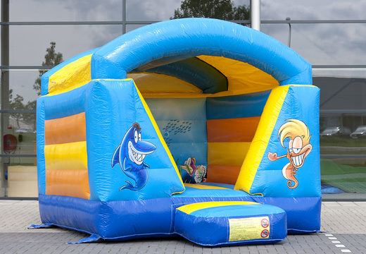 Small bouncy castle with roof for kids to buy in blue and yellow seaworld theme. Bouncy castles available at JB Inflatables America online