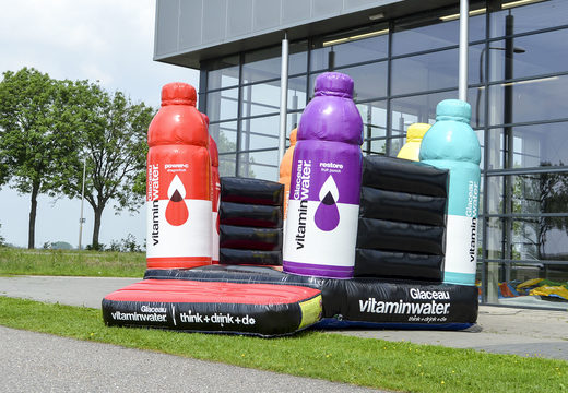Order custom inflatables online Vitamin water open bounce houses in your own corporate identity at JB Promotions America; specialist in inflatable promotional items such as custom bounce houses