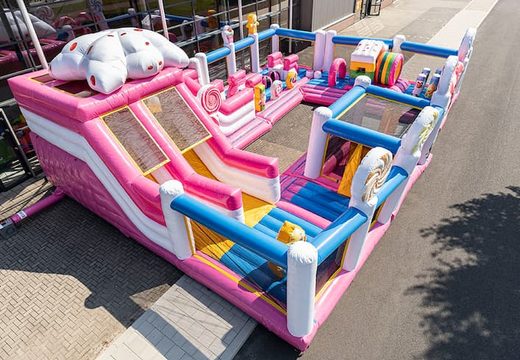 Inflatable Candyworld bouncer with slides and fun obstacles with prints for children. Buy bouncers online at JB Inflatables America