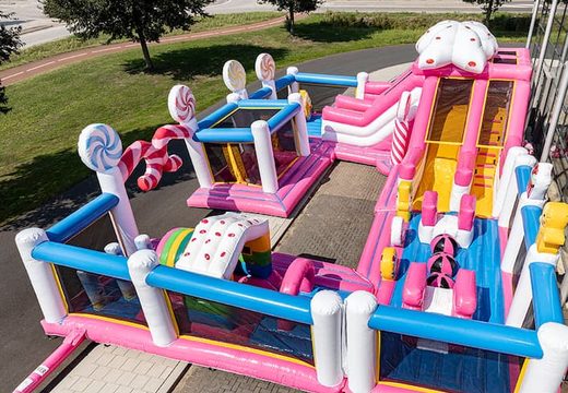 Order candyland themed inflatable bouncer with multiple slides and all kinds of fun obstacles with prints for kids. Buy bouncers online at JB Inflatables America