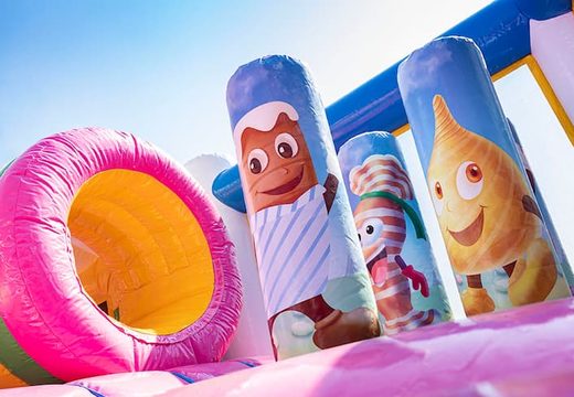 Buy Candyworld bounce house with slides, obstacles with fun candy-themed prints for kids. Order bounce houses online at JB Inflatables America