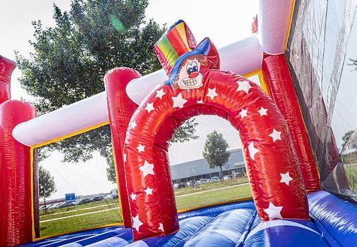 Bounce World circus bouncer with slides and all kinds of obstacles with circus prints for kids. Order bouncers online at JB Inflatables America