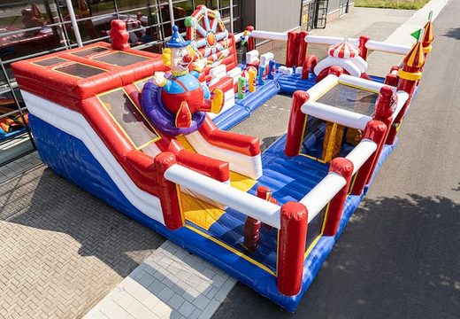 Circus themed inflatable bounce house with multiple slides and all kinds of fun obstacles with prints that match the theme for kids. Order bounce houses online at JB Inflatables America