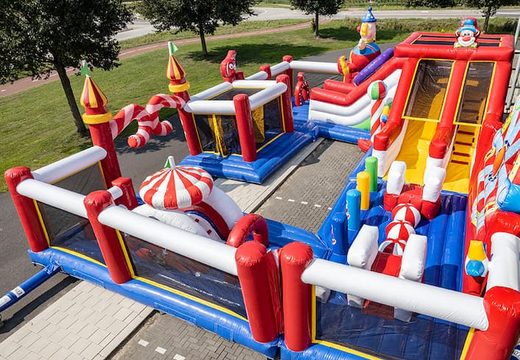 Bounce World circus bounce house with multiple slides and all kinds of fun obstacles with circus prints for children. Buy bounce houses online at JB Inflatables America