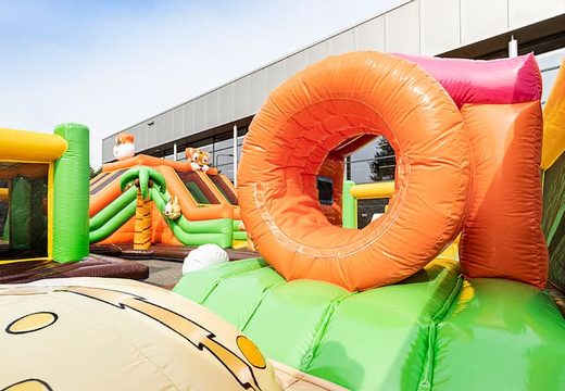 Buy Bounce World jungle bouncy castle with slides and all kinds of obstacles with jungle prints for kids. Order bouncy castles online at JB Inflatables America