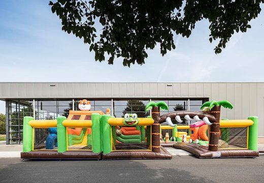 Jungle themed inflatable bounce house with multiple slides and all sorts of fun obstacles with themed prints for kids. Order bounce houses online at JB Inflatables America