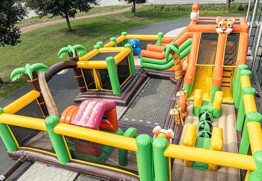 Buy a jungle bounce house with slides, obstacles and fun jungle-themed prints for kids. Order bounce houses online at JB Inflatables America