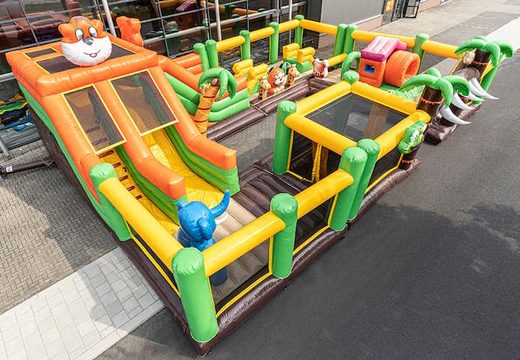 World jungle bounce house with multiple slides and all kinds of obstacles with prints that match the theme for kids. Buy bounce houses online at JB Inflatables America