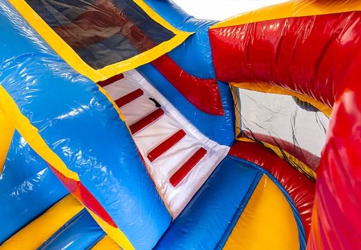 Order a multifunctional bounce house with a roller coaster theme with a slide for kids. Buy bounce houses online at JB Inflatables America 