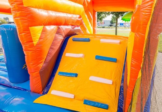 Inflatable covered bouncer in a pirate theme with a slide on the jumping surface, climbing tower and fun obstacles for kids. Buy bouncers online at JB Inflatables America 