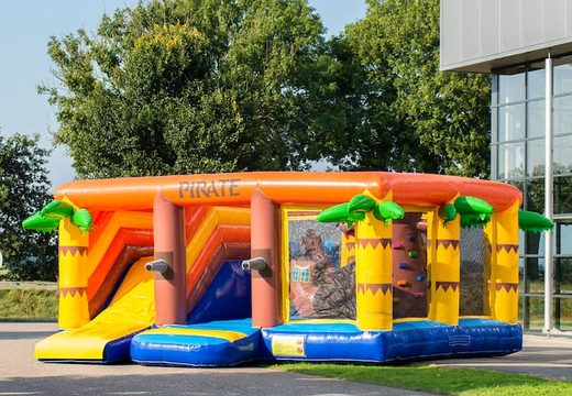Pirate themed indoor bounce house with a slide on the jumping surface, climbing tower and fun obstacles for kids. Buy bounce houses online at JB Inflatables America 