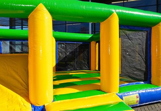 Multiplay indoor standard bouncy castle in a limited height of 2.74 meters and with a slide for children. Order bouncy castles online at JB Inflatables America 