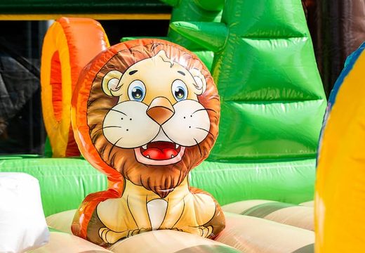 Mega inflatable jungle bouncer with slides, 3D objects, crawl tunnel and climbing tower for children. Order bouncers online at JB Inflatables America