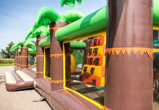 Bounce World jungle bounce house with multiple slides and all kinds of fun obstacles with jungle prints for children. Buy bounce houses online at JB Inflatables America