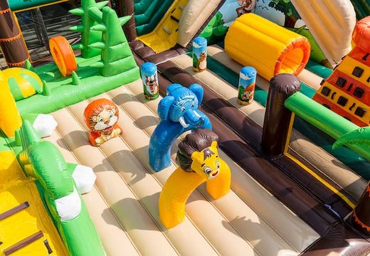 Jungle 20 meter bounce house with slides, obstacles with fun jungle-themed prints for kids. Order bounce houses online at JB Inflatables America
