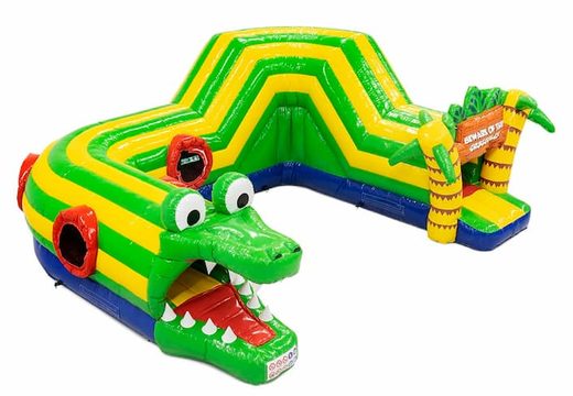 Buy an inflatable crocodile bounce house with obstacles, a climbing ramp and sliding ramp for children. Order bounce houses online at JB Inflatables America 