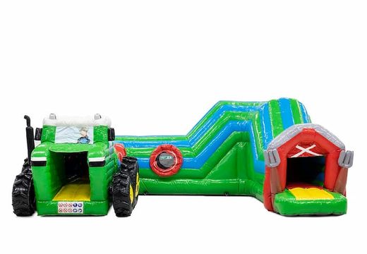 Buy a large tractor bouncy castle with obstacles, a climbing slope and a slide for children. Order bouncy castles online at JB Inflatables America 