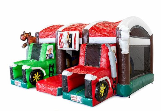 Buy a large indoor inflatable multiplay bouncy castle with slide in a farm tractor theme for children. Order bouncy castles online at JB Inflatables America 