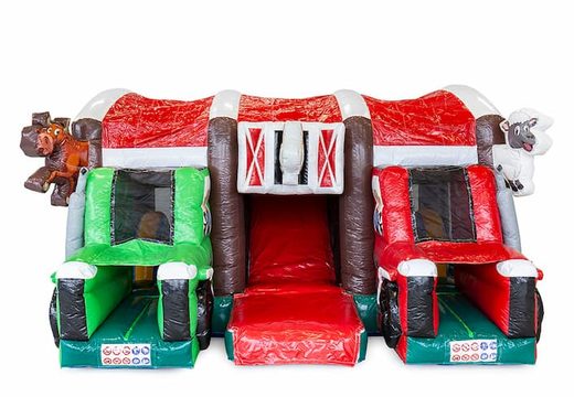 Buy an inflatable multi-play farm bounce house with a slide in the middle and 3D objects for children. Order bounce houses online at JB Inflatables America 
