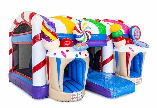 Candyland themed bounce house with a slide and 3D objects for children. Order bounce houses online at JB Inflatables America 