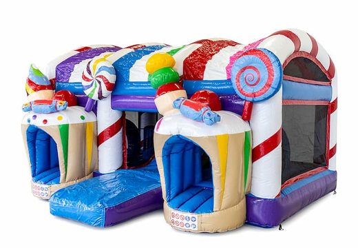 Buy large inflatable indoor multiplay xxl bouncy castle with slide in candyland theme for children. Order bouncy castles online at JB Inflatables America 