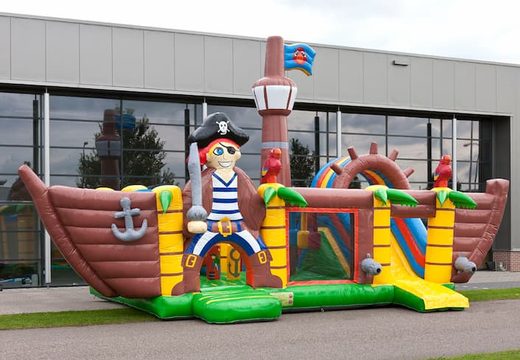 Multiplay XXL Pirate boat bounce house in a unique design with two entrances, a slide in the middle and 3D objects for children. Buy bounce houses online at JB Inflatables America 