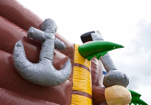 Pirate boat themed bounce house with a slide and 3D objects for children. Order bounce houses online at JB Inflatables America 