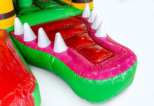 Indoor multiplay crocodile bounce house in a unique design with two entrances, a slide in the middle and 3D objects for kids. Buy bounce houses online at JB Inflatables America 