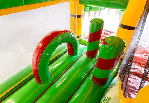 Crocodile-themed bounce house with a slide and 3D objects for children. Order bounce houses online at JB Inflatables America 