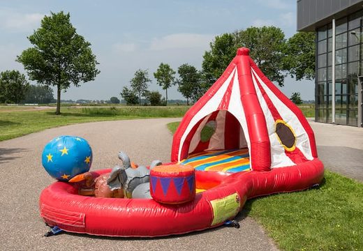 Buy a semi-open playzone Circus bouncy castle with plastic balls and 3D objects for children. Order bouncy castles online at JB Inflatables America 