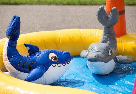 Buy a semi-open playzone seaworld bounce house with plastic balls and 3D objects for children. Order bounce houses online at JB Inflatables America 