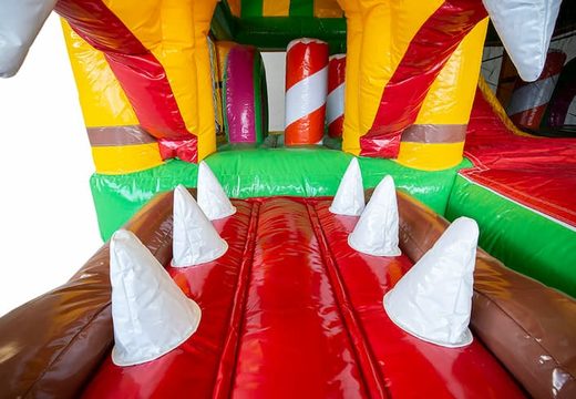 Order inflatable multiplay Jungleworld bounce house with a slide and 3D objects for kids. Buy bounce houses online at JB Inflatables America 