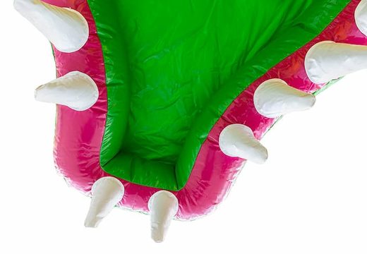 Order a Jungleworld themed bouncer in a unique design with two entrances, a slide in the middle and 3D objects for children. Buy bouncers online at JB Inflatables America 