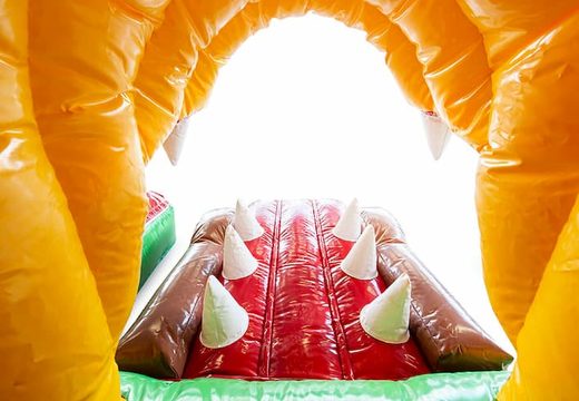 Jungleworld themed bouncy castle with a slide and 3D objects for children. Order bouncy castles online at JB Inflatables America 