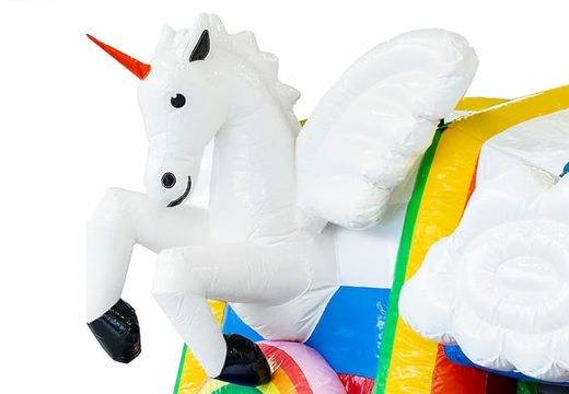 Inflatable multiplay unicorn bounce house with a slide in the middle and 3D objects for children. Order bounce houses online at JB Inflatables America 