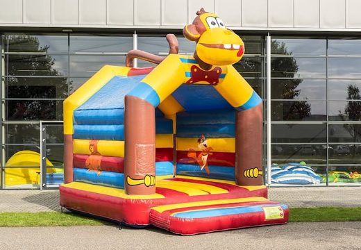 Buy a standard bounce house in striking colors and with a large 3D object of a monkey on top for children. Order bounce house online at JB Inflatables America