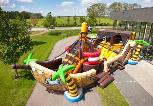 Buy Mega Pirate Shooter ship shape bouncer with cannon game and slide for kids. Order bouncers online at JB Inflatables America