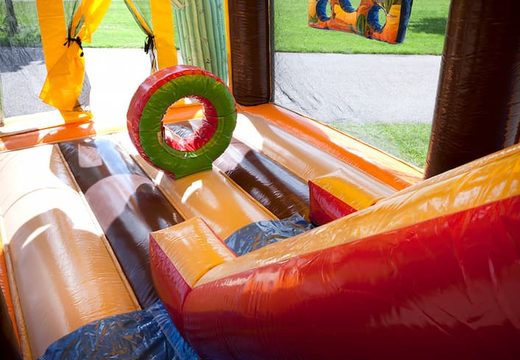 Buy shooting combo western bounce house covered, with cannon game and slide for kids. Order inflatable bounce houses online at JB Inflatables America