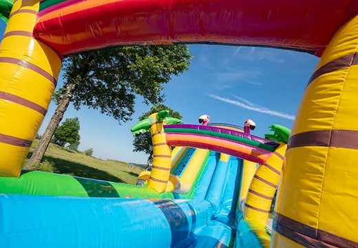 Order Drop & Slide Jungle bounce house with double slide for children. Buy bounce houses online at JB Inflatables America