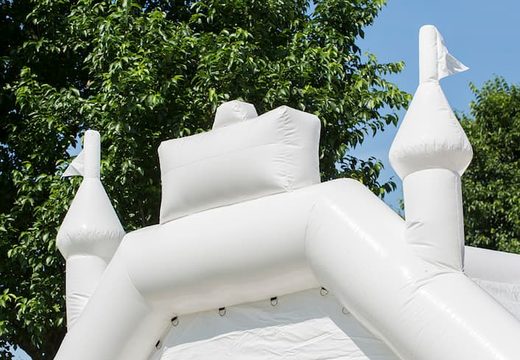 Buy standard white wedding themed bounce houses in the form of a children's castle. Buy bouncy castles online at JB Inflatables America